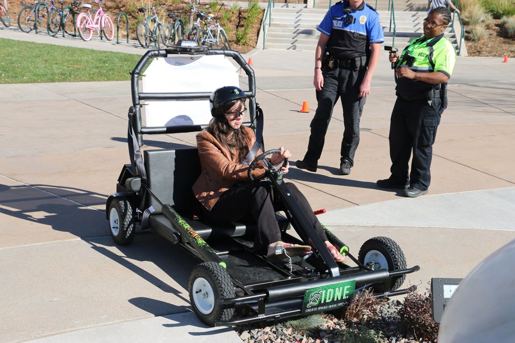 A women driving a SIDNE cart